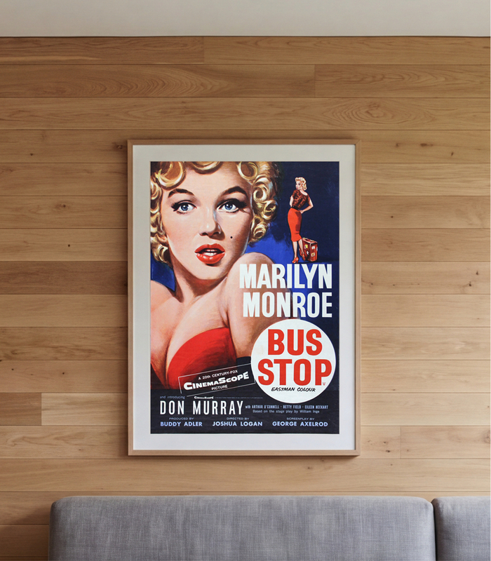 Framed Marilyn Monroe Bus Stop poster on a wood wall