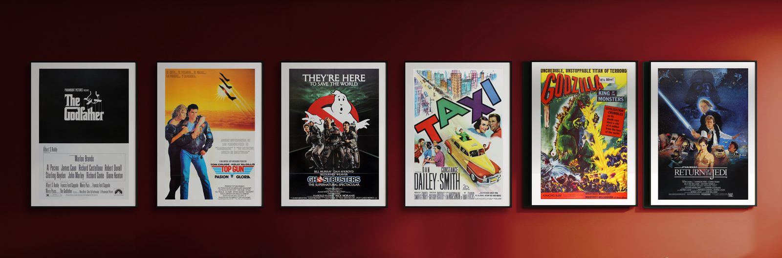 Framed movie posters on a red wall